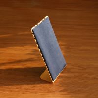 L-shaped gold edged vel...